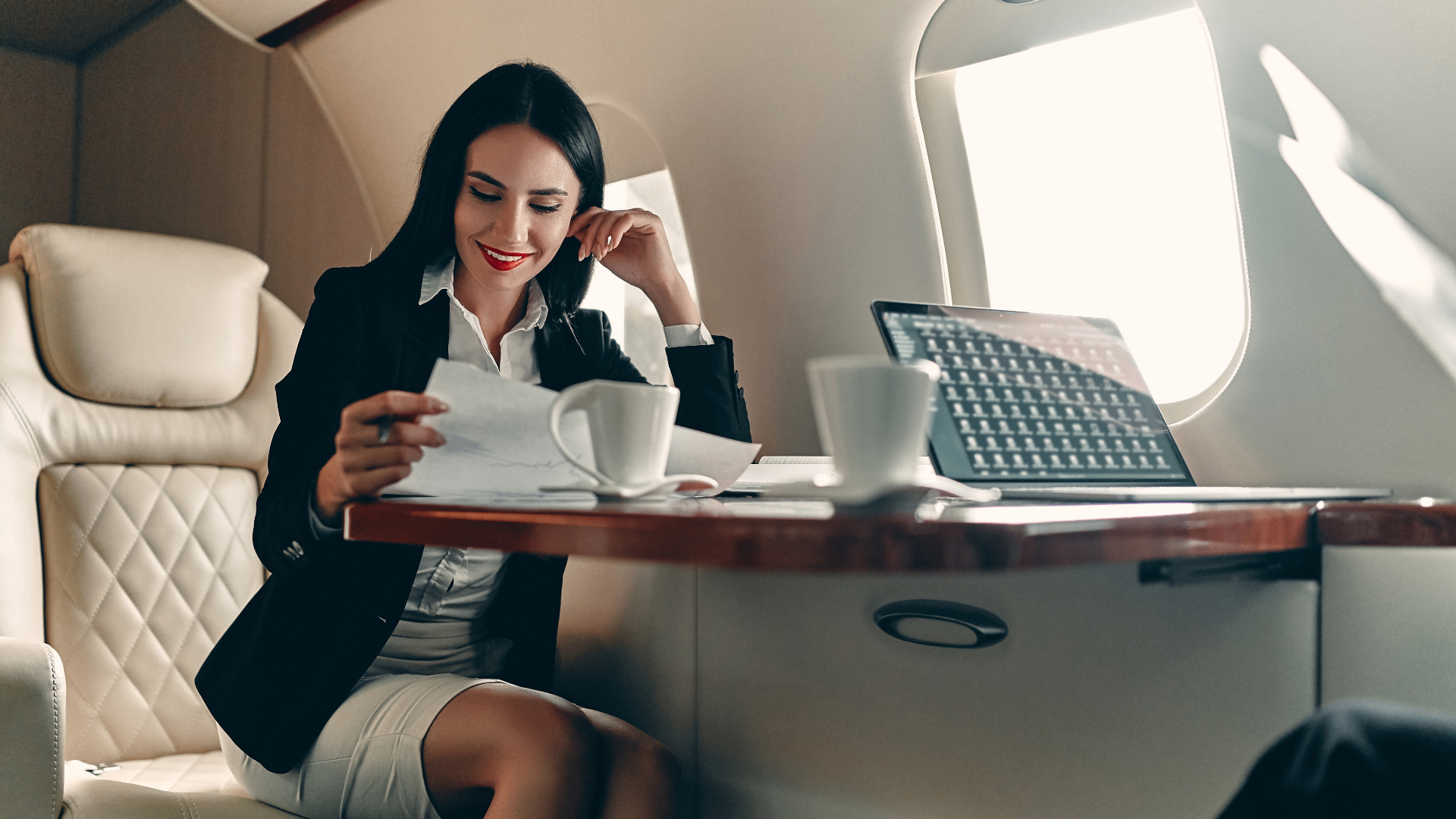 Businesswoman working on board a private jet