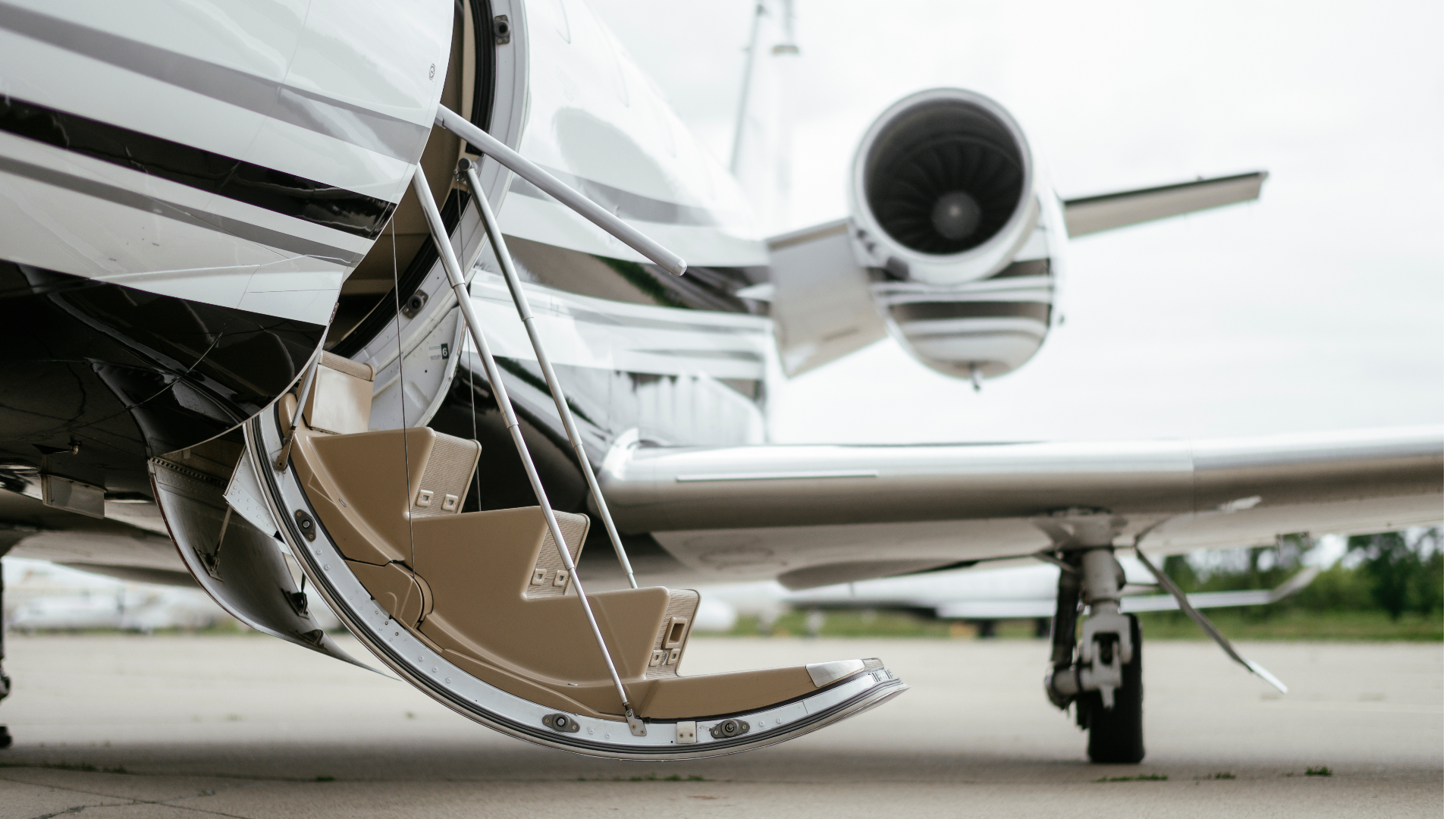 Private jet with open airstair on the tarmac